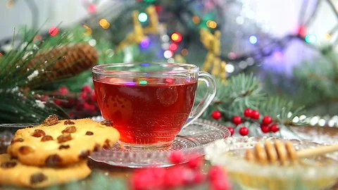Winter tea A cup of tea with honey and croissant or cookies, a branch of a Stock Footage 83664890
