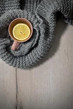 Winter Tea In A Mug With Lemon Chips And A Scarf Stock Photos