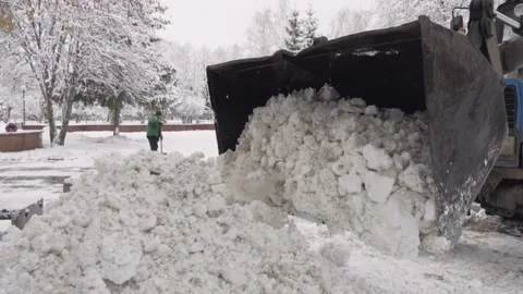Winter. Technique clears snow from the streets of the city. City snow removal Video stock 165855895
