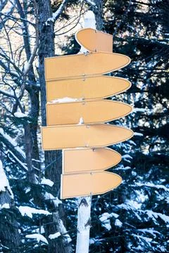 In winter, there are many pointers on the post in the form of arrows. Place f Stock Photos