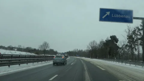 Winter time on the highway.Driving on the freeway A13 direction Spreewald 스톡 동영상 148132964