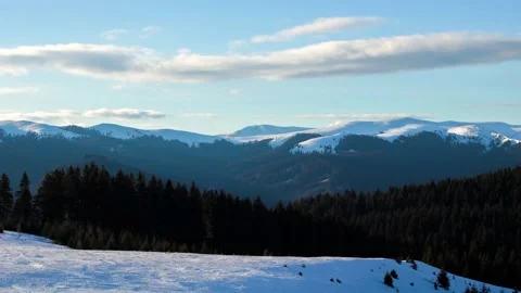 Winter time lapse in mountain environment with clouds moving in the background Stock Footage 235728019