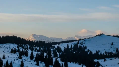 Winter time lapse of mountains covered with snow with clouds moving Video stock 234744223