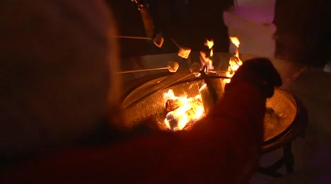 Winter Time Marshmallow Roasting over Open Fire - Treats on a stick Stock Footage 59764693