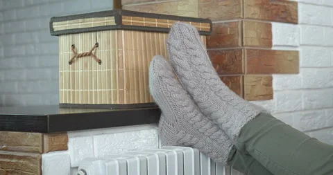 Winter time by radiator. Stock Footage 162938835