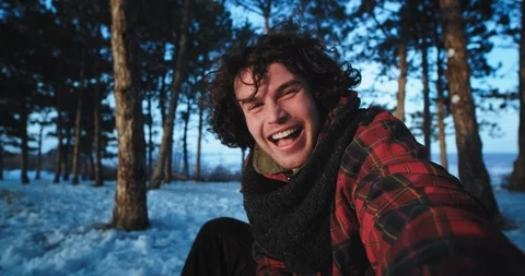 In a winter time a tourist alone make a video with his camera capturing his self Stock Footage 112633691
