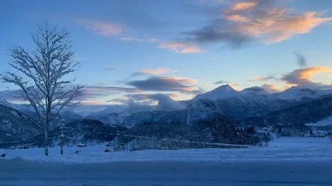 Winter timelapse of snowy mountains and moving clo Stock Footage 337365111