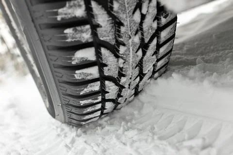 Winter Tire in Deep Snow with Deep Track Stock Photos