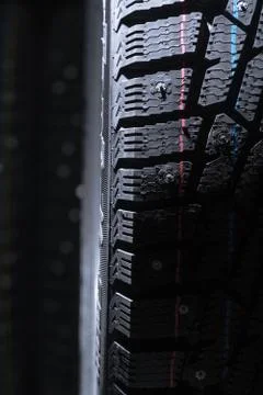 Winter tire protector. Spot light falls from the top Stock Photos