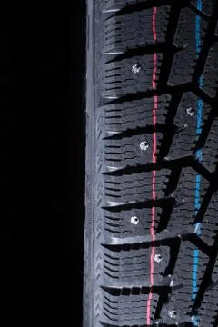 Winter tire protector. Spot light falls from the top Stock Photos
