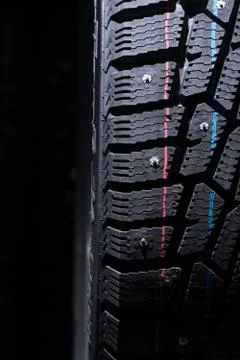 Winter tire protector. Spot light falls from the top Foto stock