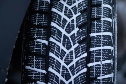 Winter tire tread on a snow-covered road Stock Photos