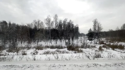 Winter town train road trip side window with a beautiful landscape. Nature white Stock Footage 227744587