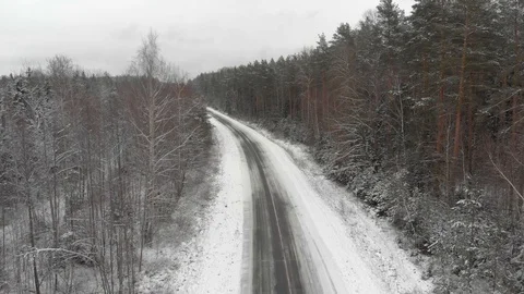 Winter track through the forest and trees covered with snow. Panoramic image 動画素材 129312580