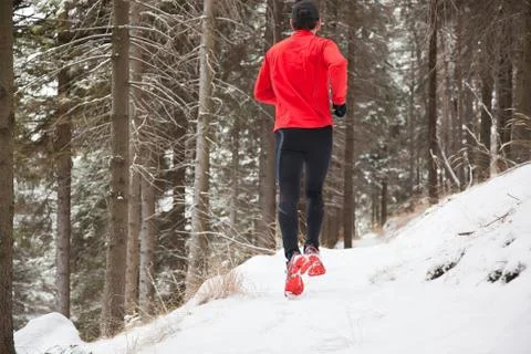 Winter trail running Stock Photos