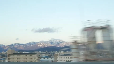 Winter train travel through japan countryside with view of snow covered on .. Stock Footage 335579229
