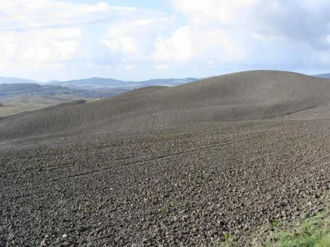 Winter Tuscany landscape with plowed fields at morning Stock Photos