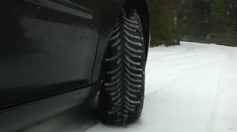 Winter tyres on a car in snow Stock Footage 11301575