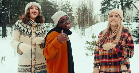 WINTER VACATION. Happy fun multiethnic young friends dance together in warm hats Stock Footage 160355025