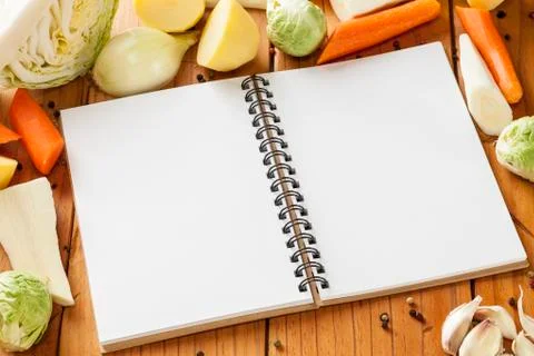 Winter vegetables and notebook for your recipe. Stock Photos