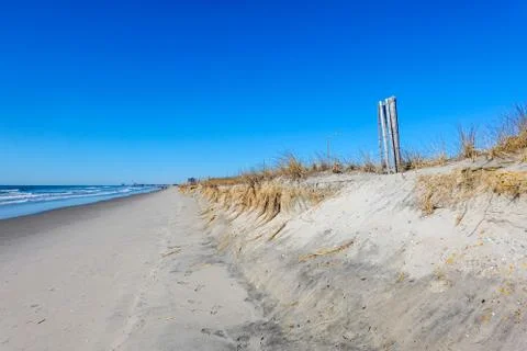 Winter view along a sandy beach showing beach sand erosion Stock Photos