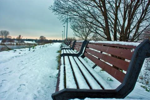 Winter view on the bench with snow Stock Photos