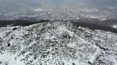 Winter view of city of Sofia and Kamen Del Peak at Vitosha Mountain, Bulgaria Stock Footage 157912935