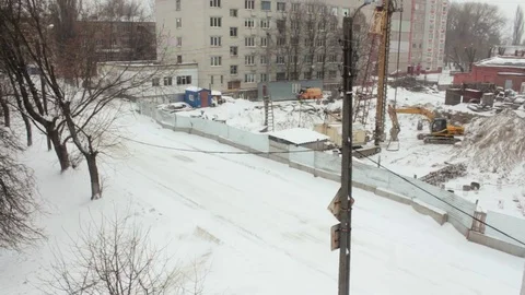 Winter view of the construction site, the falling snow Stock Footage 71221847