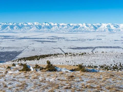 Winter View of Issyk Kul Basin with Snow-Covered Ala-Too Range Stock Photos