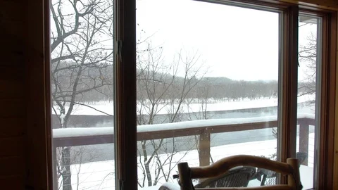 Winter view from the log cabin window by the river Stock Footage 103954828