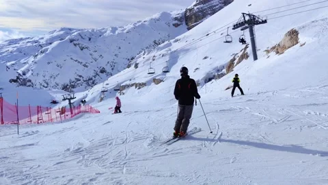 Winter view of the mountains with clouds below on the ski resort Stock Footage 230178147