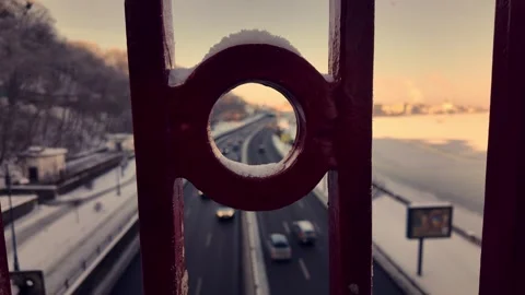Winter View of Road Traffic Through Pedestrian Bridge Railing Stock Footage 332337372