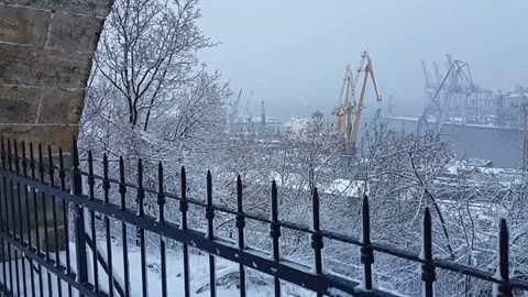 Winter view through the stone arcade to the port. Stock Footage 147987143