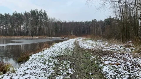 Winter walk through landscape on a pond. Ice on lake. Video stock 146312308