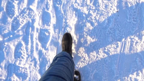 Winter Walking Point of View With Boots on Snow Covered Road Stock Footage 328916325