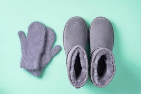 Winter warm clothes flat lay. Wool feminine clothes sweater, scarf, boots. Top Stock Photos