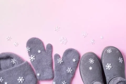 Winter warm clothes flat lay. Wool feminine clothes sweater, scarf, boots Stock Photos