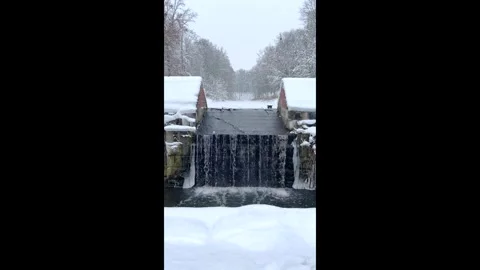 Winter waterfall on the ancient stream Stock Footage 288454201