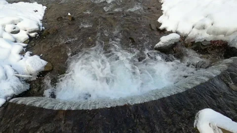 Winter waterfall in the Carpathians, static plan. Water beats against stones Stock Footage 177590881