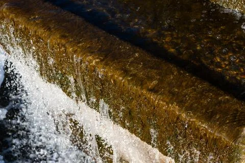 Winter waterfall. Diagonal lines. Weak waterfall water pressure Stock Photos
