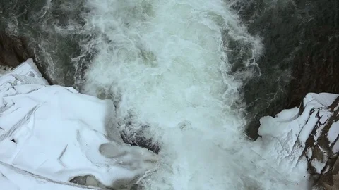 Winter waterfall. Water flow under ice. Flowing water under ice Video stock 72198201