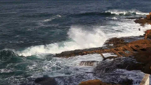 Winter waves crashing against the rocks Stock Footage 81536722