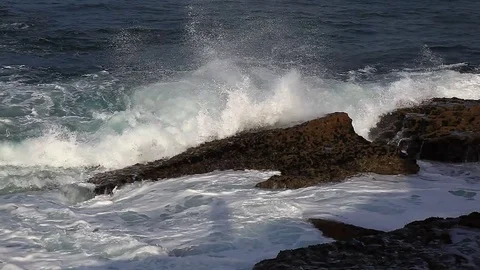 Winter waves crashing against the rocks Stock Footage 81536733
