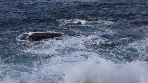 Winter waves crashing against the rocks Stock Footage 81536735
