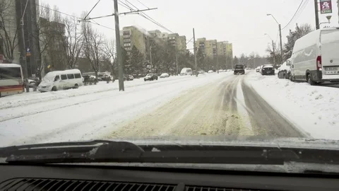 Winter weather on the car road - falling snow Stock Footage 87640869