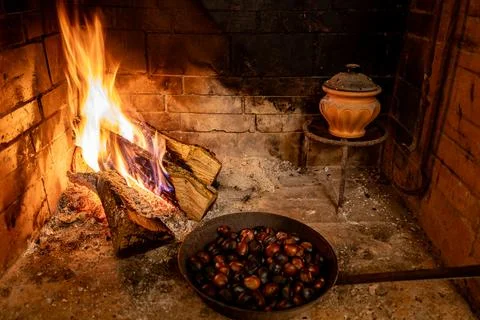 In winter, while it snows outside and the polar cold rages, the wood-burning  Stock Photos