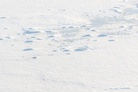 Winter white texture drone shot of ice and snow on a frozen lake Stock Photos