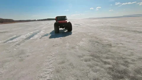 Winter Wilderness Trek. Bold ATV Adventure on Ice. FPV Aerial Drone shot Stock Footage 262629906