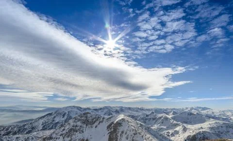 Winter wonderland sky and clouds scenic view from the top of the mountain Stock Photos