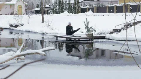 Winter yoga session. Man in black Video stock 83916754